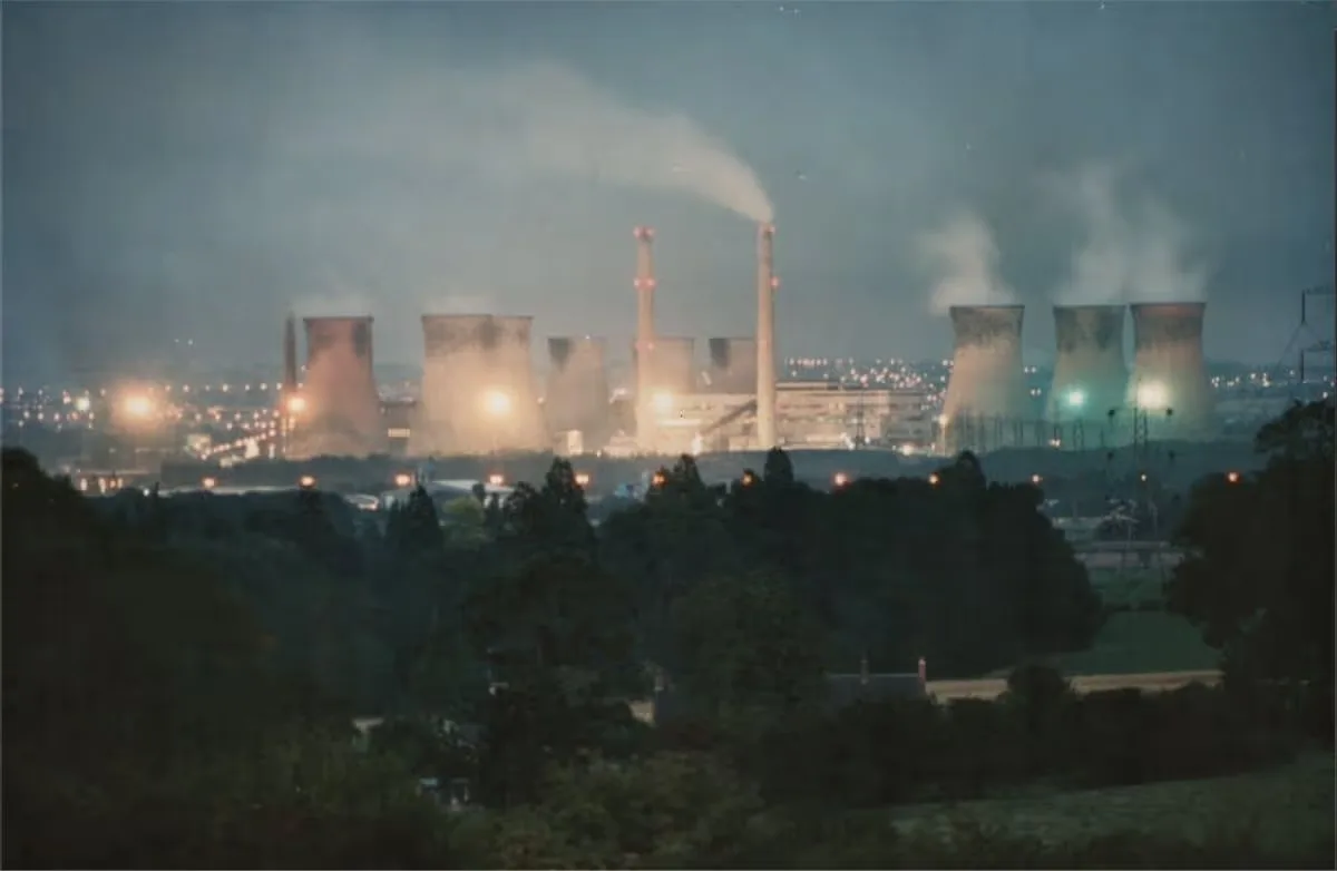 Drakelow Power Station illuminated at night in the 1980s, with cooling towers and chimneys visible