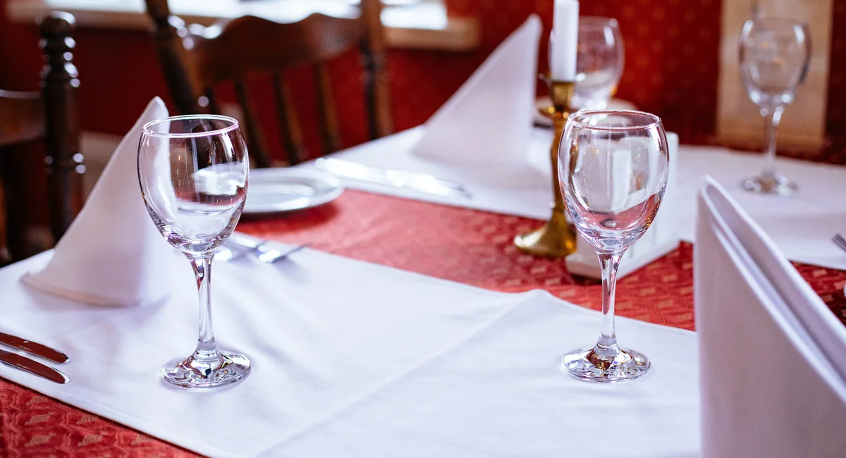 Restaurant table set for an evening meal